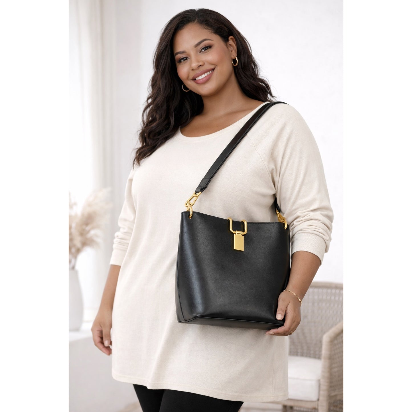 Sleek Black Faux Leather Shoulder Bag with Sculpted Fold-Down Gold Closure Y2K
